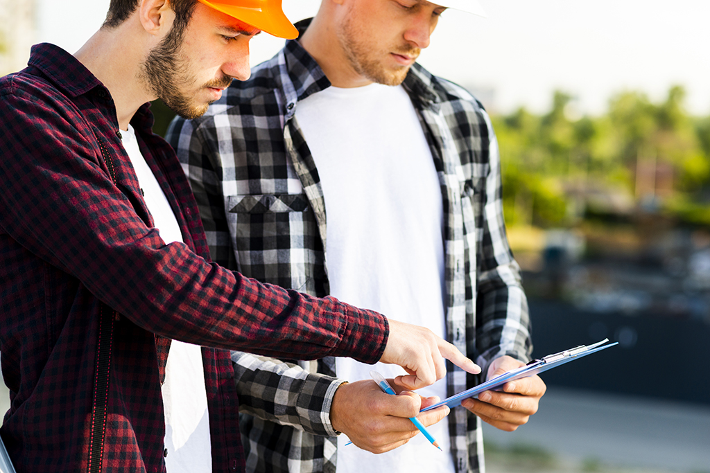 engineer-architect-looking-clipboard